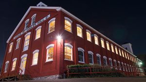 The Thomas Kay Woolen Mill at night at the Willamette Heritage Center